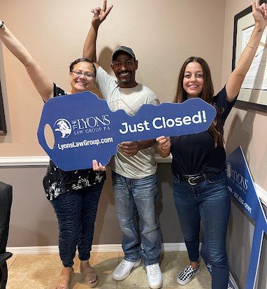 Jenn Mitchell celebrating a closing with happy Tampa home buyers